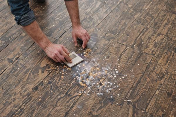 Founder working on vinyl floor installation project